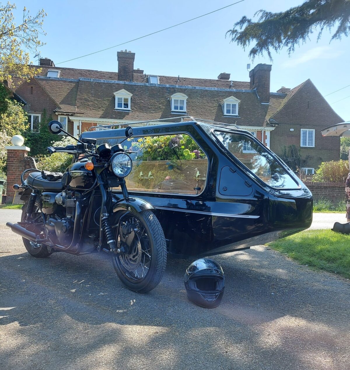 Black Triumph Bonneville Bike with side hearse & coffin side hearse