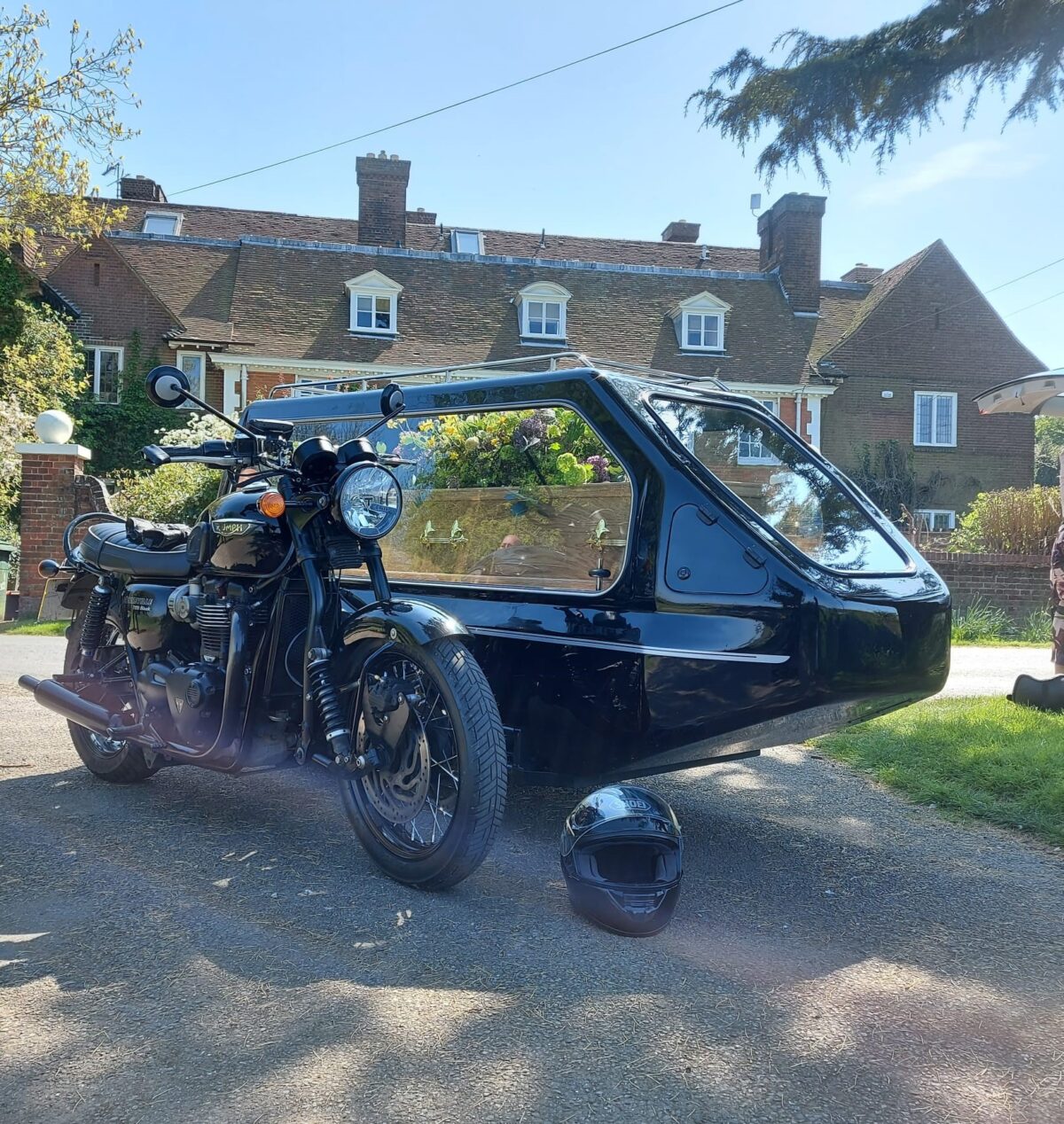 Black Triumph Bonneville Bike with side hearse & coffin side hearse